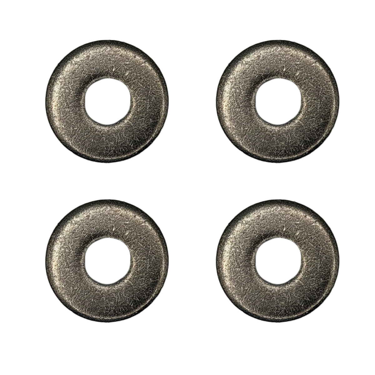 Four metallic washers on a white background