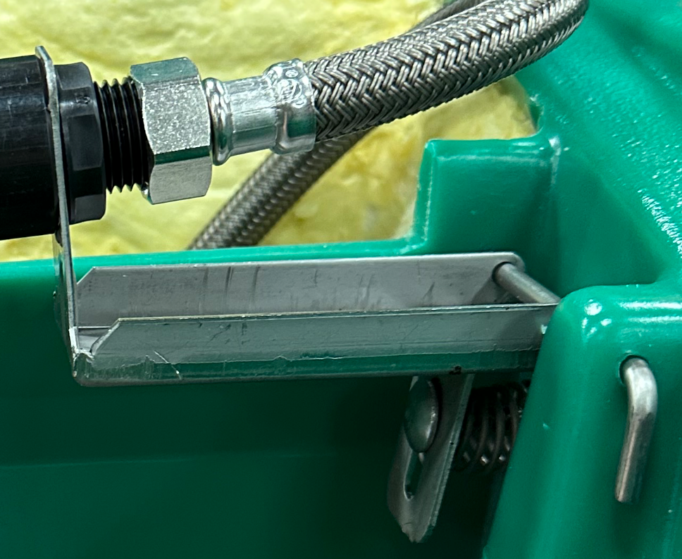 JUG valve bracket 10714 installed in a four hole JUG waterer
