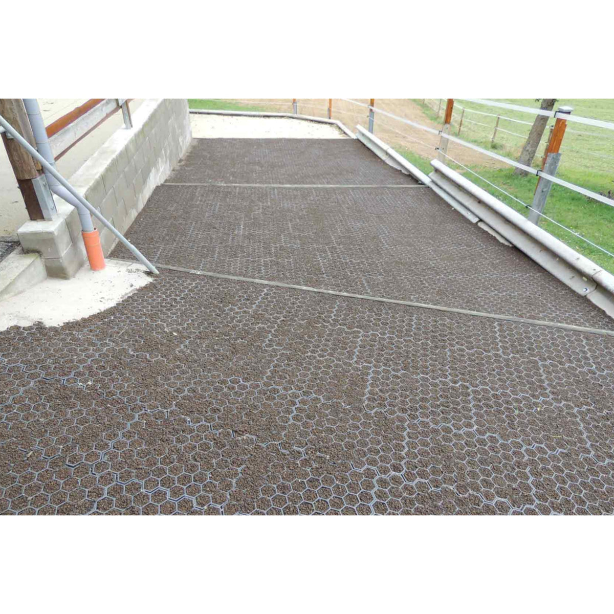 Hahn Paddock Slabs filled with footing beside a barn downspout