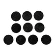Set of black round felt pads on a white background