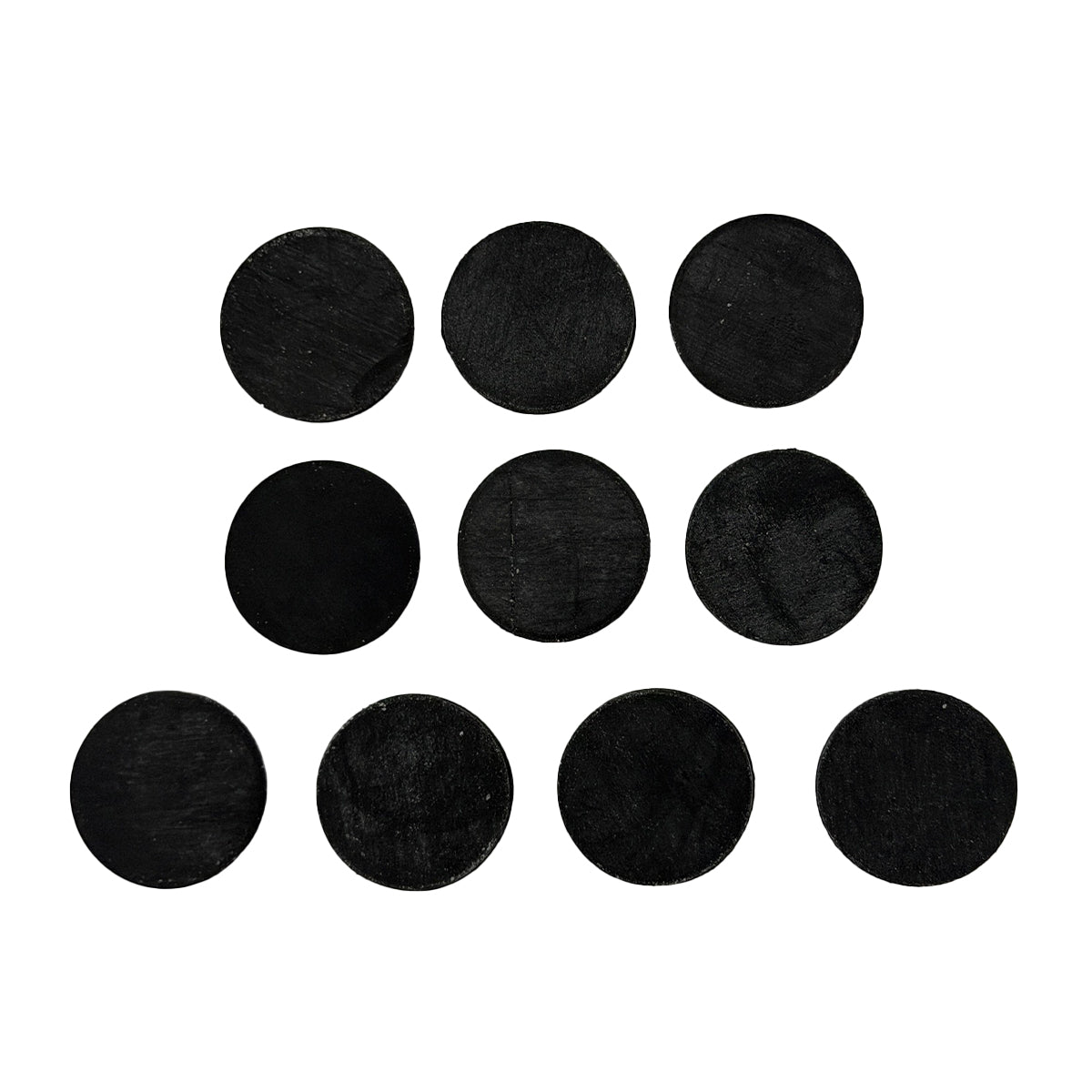 Set of black round felt pads on a white background