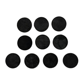 Set of black round felt pads on a white background