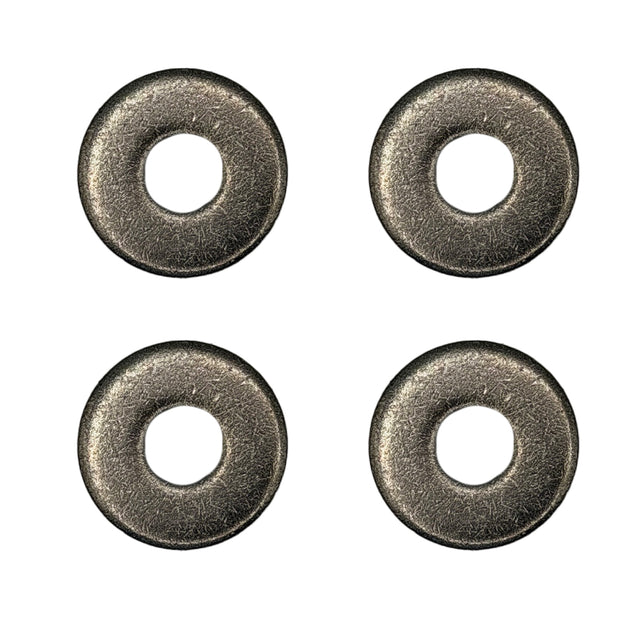 Four metallic washers on a white background