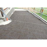 Hahn Paddock Slabs filled with footing beside a barn downspout