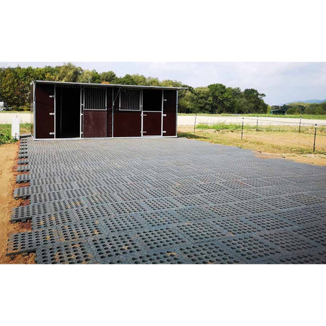 Hahn Mud Control Grids laid across a large area in front of a run in shed