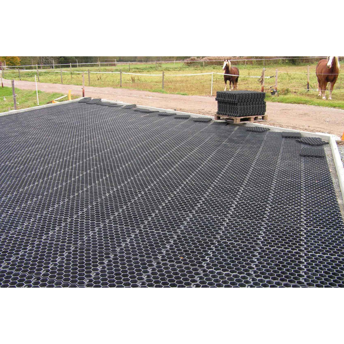 Hahn Paddock Slabs installed across a paddock with a pallet of slabs waiting to be laid