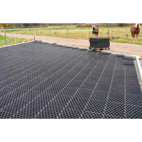 Hahn Paddock Slabs installed across a paddock with a pallet of slabs waiting to be laid